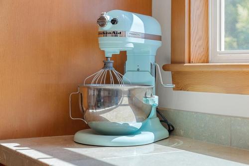 a blue mixer sitting on top of a counter at Fountain District Craftsman in Bellingham