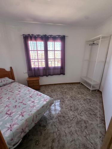 Ένα ή περισσότερα κρεβάτια σε δωμάτιο στο La Casa Rosada