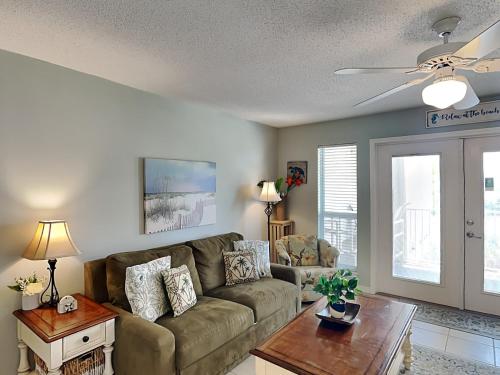 a living room with a couch and a table at Grand Caribbean Perdido Key #306 West in Perdido Key