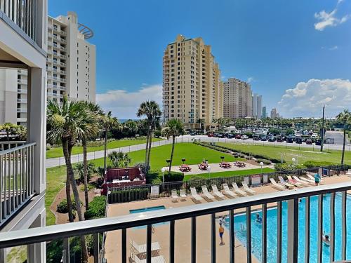 a view of the pool from the balcony of a resort at Grand Caribbean Perdido Key #306 West in Perdido Key