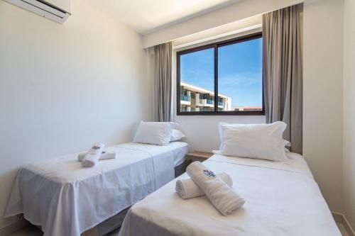 Katil atau katil-katil dalam bilik di Mana Beach Experience Muro Alto By Carpediem