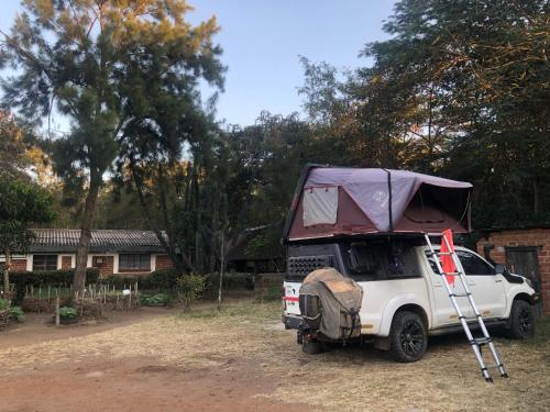 a white truck with a tent on top of it at Tiko Community Centre in Saint Francis