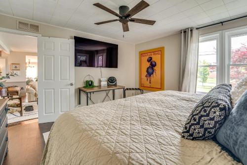 a bedroom with a bed and a ceiling fan at Canal-Front St Clair Shores Home 2 Mi to Dtwn in St. Clair Shores