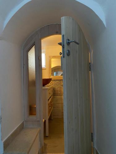 an open door to a bathroom in a house at In centro da Cinzia in Ostuni