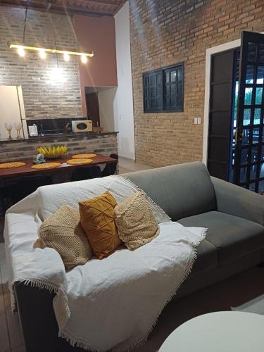 a couch with pillows on it in a living room at Areia Green in Areia
