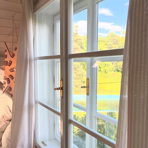 an open window with a view of a mountain at Stodola Jankovna 