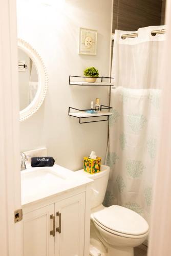a bathroom with a toilet and a sink and a shower at Sailors Delight in Beaufort