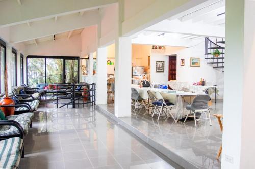 a living room with a table and chairs at Private luxury house 3 floors in Los Altos de Cerro Azul