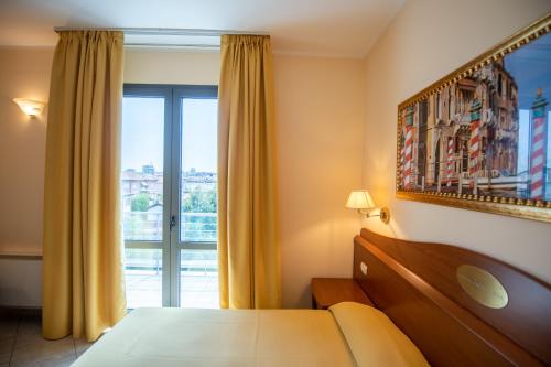 Ένα ή περισσότερα κρεβάτια σε δωμάτιο στο Hotel Ambasciata Venice - Atika & Atif