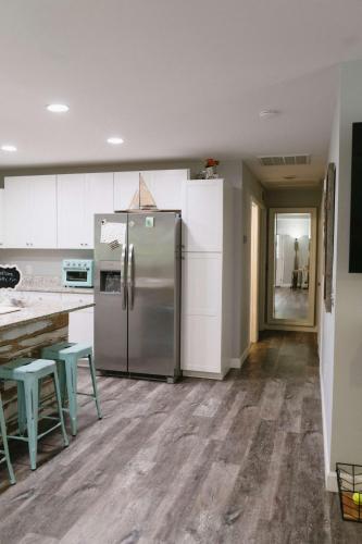 a kitchen with a stainless steel refrigerator and a counter at Sailors Delight in Beaufort