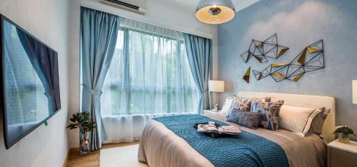 a bedroom with a bed and a large window at Homestay at Trion KL in Kuala Lumpur