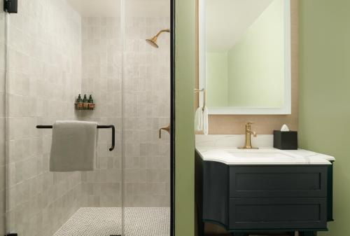 a bathroom with a sink and a shower at The Milo in Santa Barbara