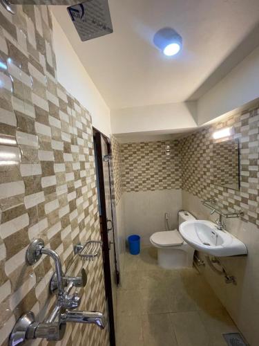 a bathroom with a toilet and a sink at Cityview Guest House in Kathmandu
