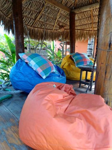 two bean bags and a tent on a porch at Pousada Kite Guajiru in Itarema