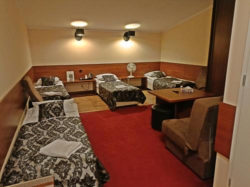 Postel nebo postele na pokoji v ubytování Hotel Ajax