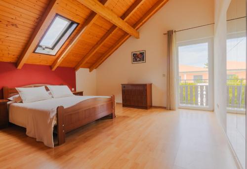 En eller flere senge i et værelse på House Dinavast Casa dos Ases