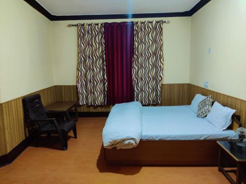 Кровать или кровати в номере Togochey Guest House