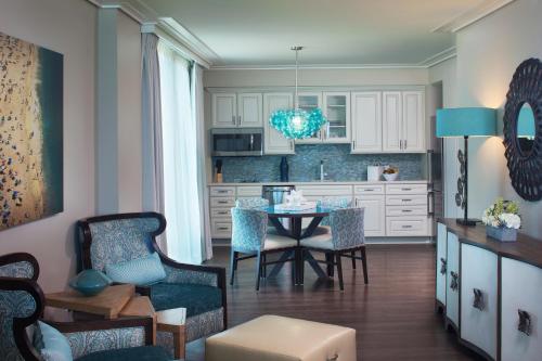 a kitchen and dining room with a table and chairs at Opal Sands in Clearwater Beach