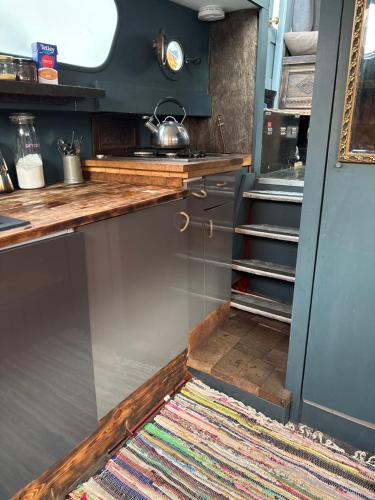 a small kitchen with a rug on the floor at Potato in London
