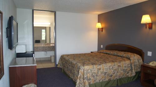 Postel nebo postele na pokoji v ubytování Executive Inn