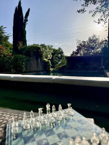 a glass chess set on top of a table at I Fontanili in Civita Castellana
