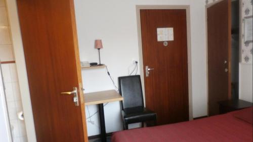 Postel nebo postele na pokoji v ubytování Hotel Heynen