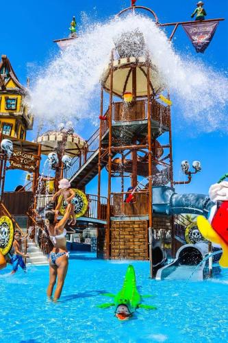 a group of people in the water at a water park at Caesar Resort Apartments Marcellus 51 in Iskele