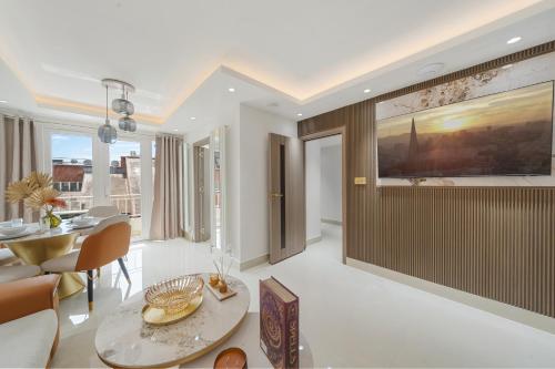 a living room with a table and a dining room at Prime Mayfair Luxury Stunning 2 Bedroom Apartment H12 in London