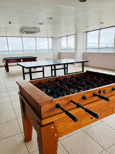 a room with a large wooden table with guns on it at Blue Tree Premium Manaus in Manaus