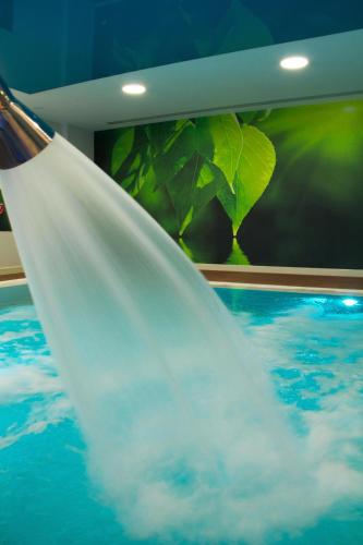 a stream of water in a pool of water at Kipriotis Panorama Hotel & Suites in Kos Town