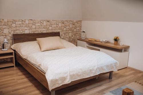 a small bedroom with a bed and a table at Rekreační a školicí středisko Zájezek in Chlum u Třeboně