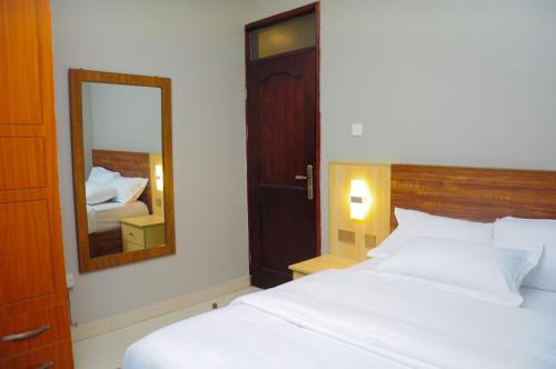 Voodi või voodid majutusasutuse White Cottage Suites toas