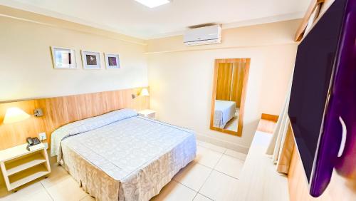 Cama ou camas em um quarto em diRoma Piazza direto com o Grupo diRoma com acesso ao Acqua Park e Café da manhã