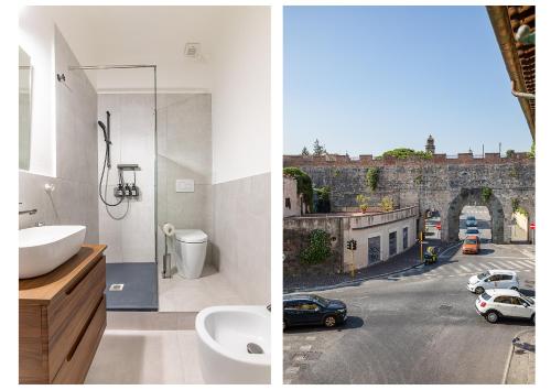 ein Bad mit einem Waschbecken und Straßenblick in der Unterkunft Casa Vacanza Torre Pendente - grandi camere comfort in Pisa