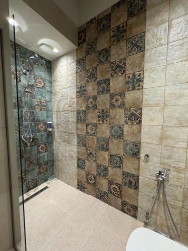 a bathroom with a shower and a toilet in it at Maresol in Nea Kalikratia