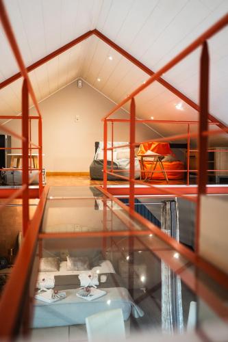 a room with two bunk beds and a glass floor at Le Nid d'Ange in Ohey