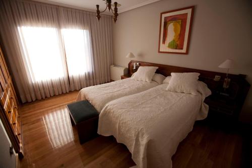 Säng eller sängar i ett rum på Villalodosa