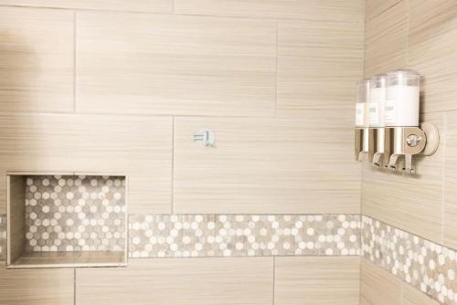 a bathroom with a shower with a soap dispenser at Sailors Delight in Beaufort