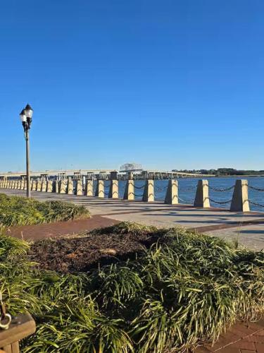 a light pole next to the ocean with a pier at Sailors Delight in Beaufort