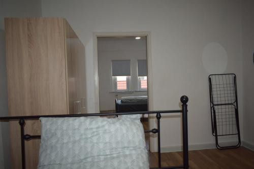 a bedroom with a bed and a large mirror at Ferienwohnung in Gotha in Gotha