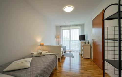 a bedroom with a bed and a desk in a room at Villa Panorama Hill by Villas Guide in Cestica