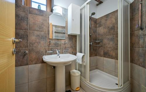 a bathroom with a sink and a shower at Villa Panorama Hill by Villas Guide in Cestica
