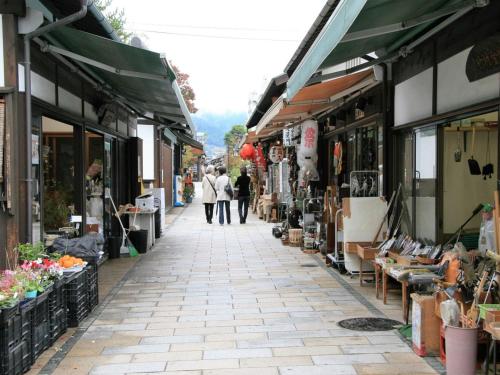 a street with shops and people walking down the street at Ebisuya - Vacation STAY 31583v in Hirayu