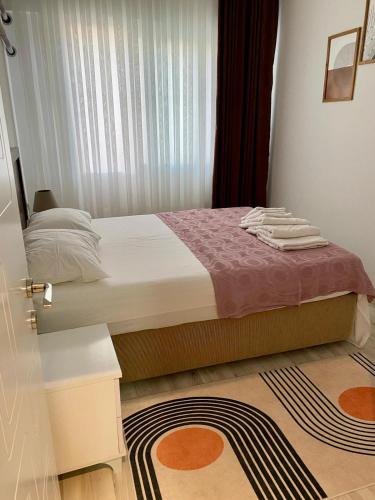 Una cama o camas en una habitación de Apart Daire