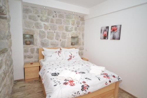Postel nebo postele na pokoji v ubytování Apartments Risan