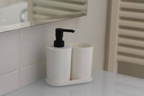 a bathroom sink with a faucet on a counter at La casa Bianca di Luca in Fiumicino
