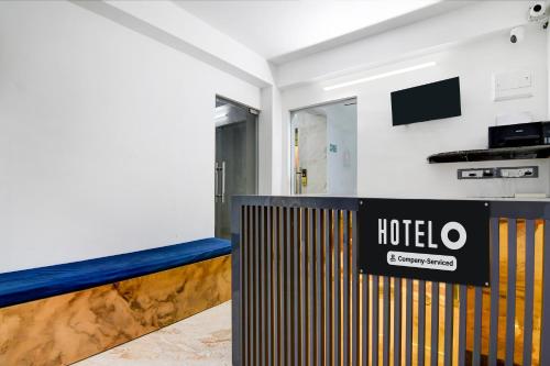 a hotel room with a sign on the wall at Super Hotel O New Town Near Downtown Mall in Pānchuria