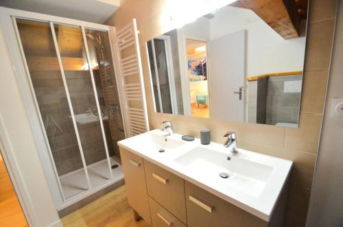 a bathroom with a sink and a shower at Chalet Barthelemy - Petit cocon authentique dans les 3 vallées MAE-4204 in Saint-Martin-de-Belleville