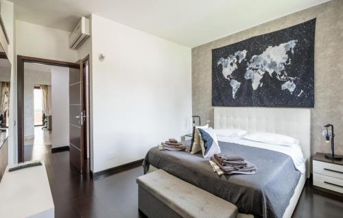 a bedroom with a bed with a map on the wall at Lovely Home In Velletri With Wifi in Velletri
