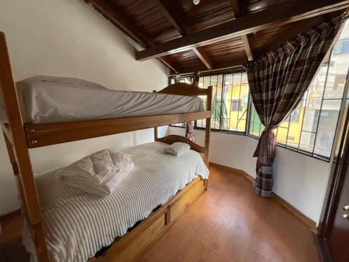 Postel nebo postele na pokoji v ubytování Accommodation in Quito